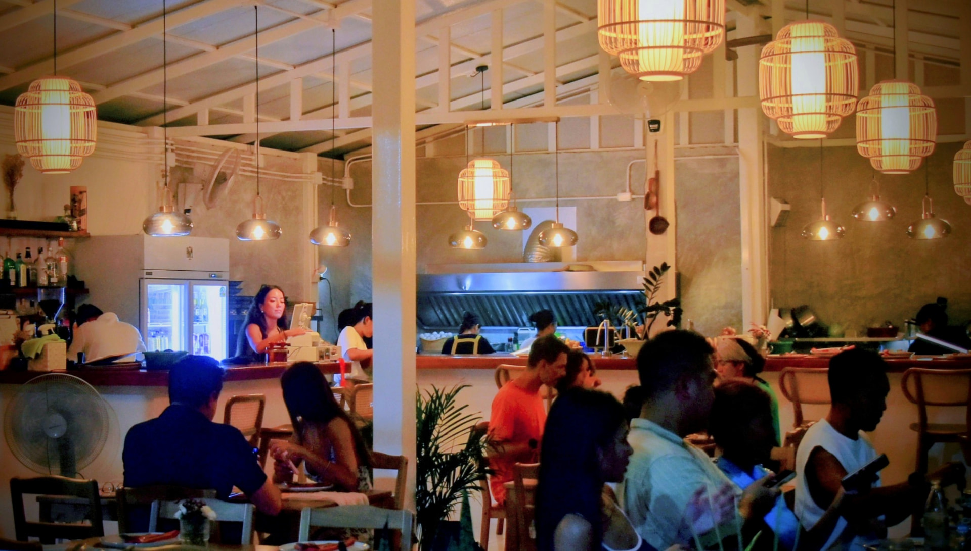 View across the dining room towards the bar and open kitchen
