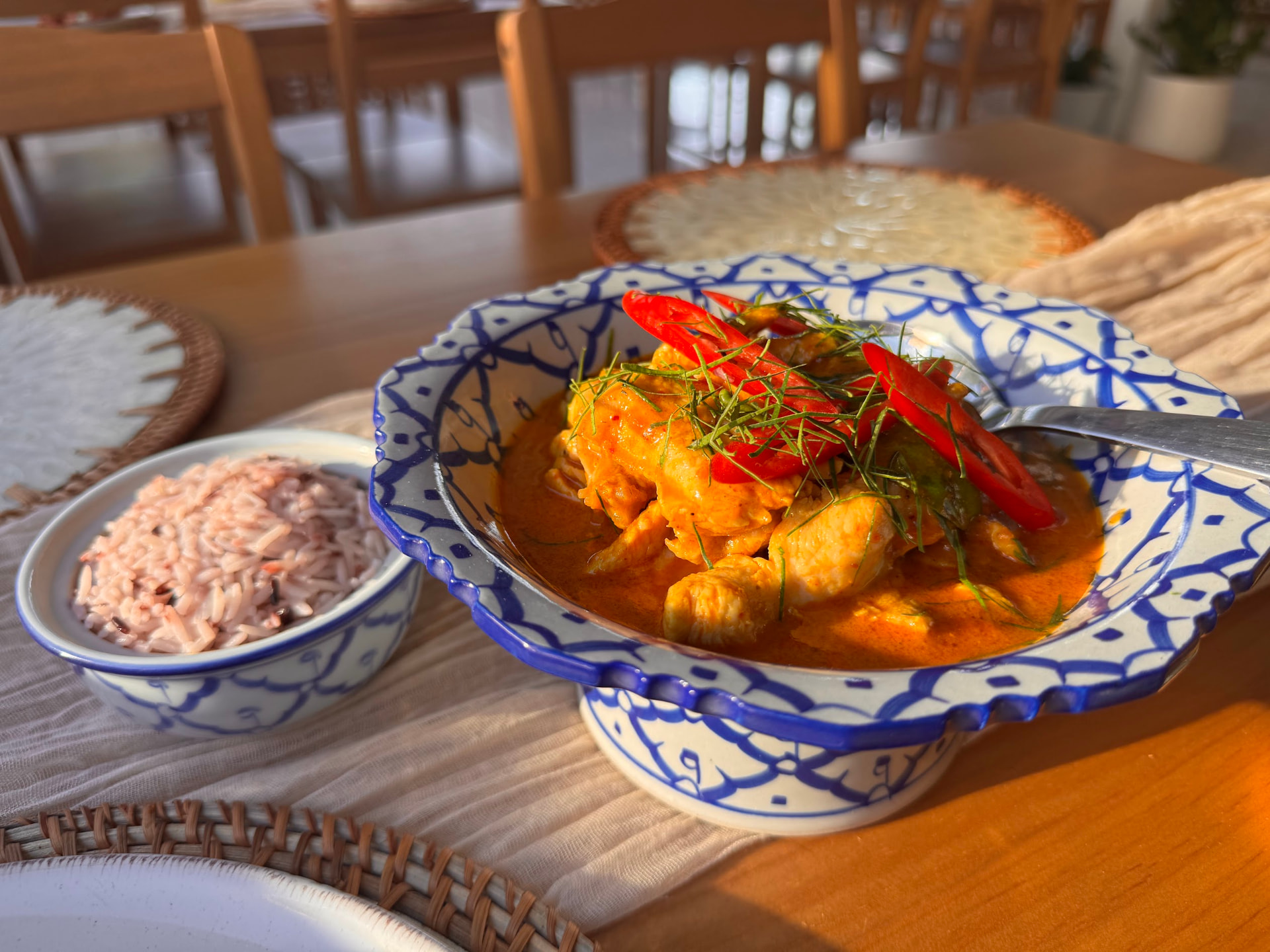 Panang curry with chicken, chilli and kaffir lime leaves, served with rice berry rice