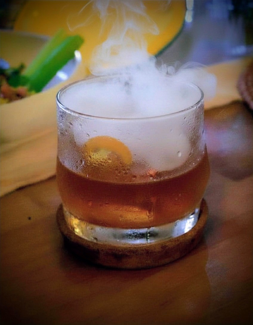 Smoked old fashioned cocktail served over ice