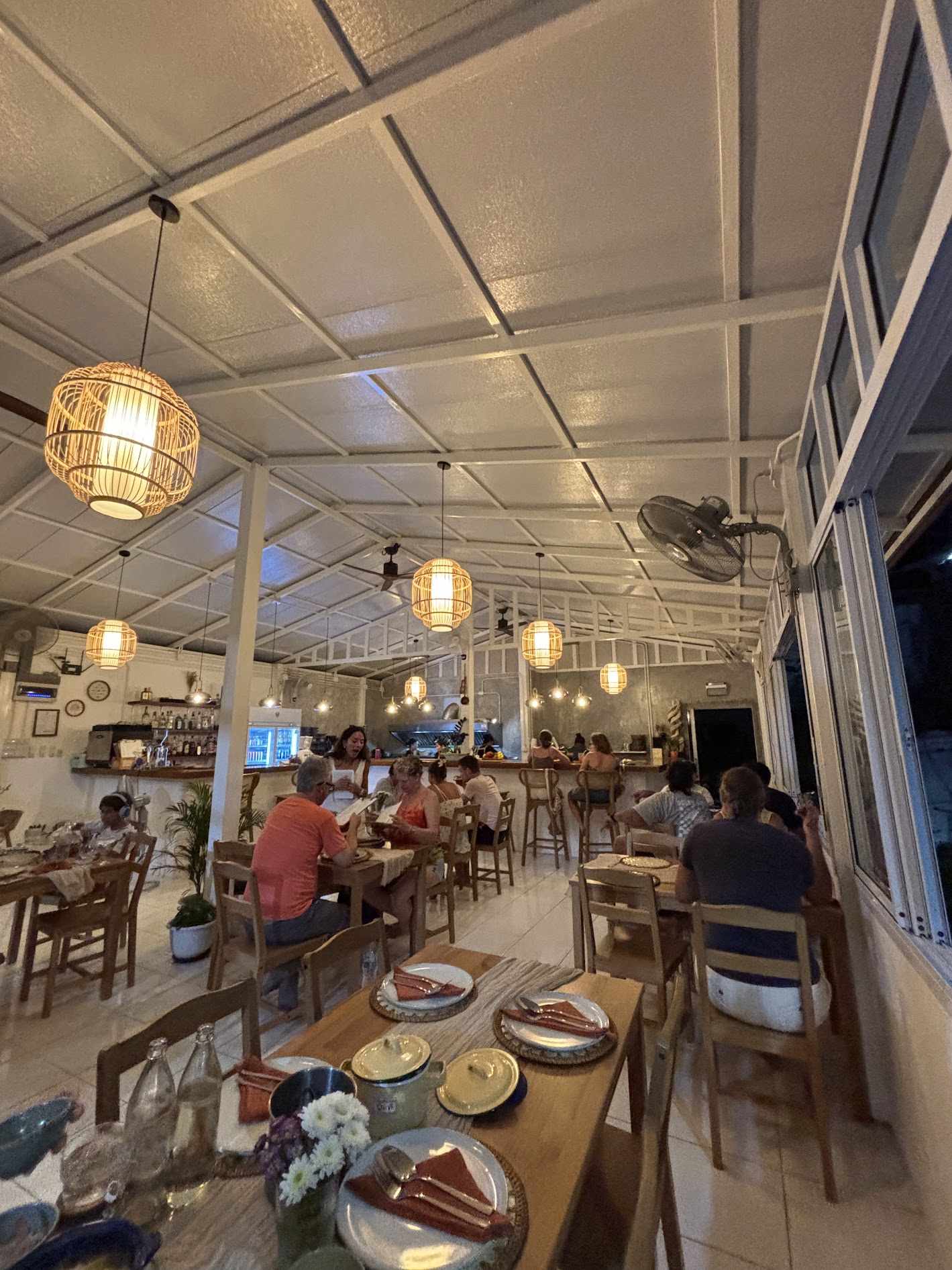 Warm lantern-lit dining room at P.oy's Place