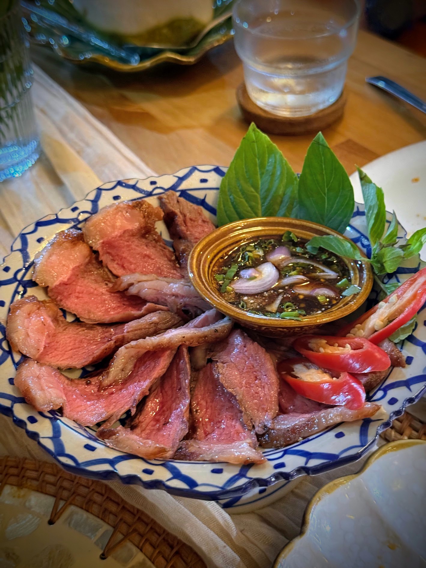 Sliced picanha steak with nam jim jeaw dipping sauce
