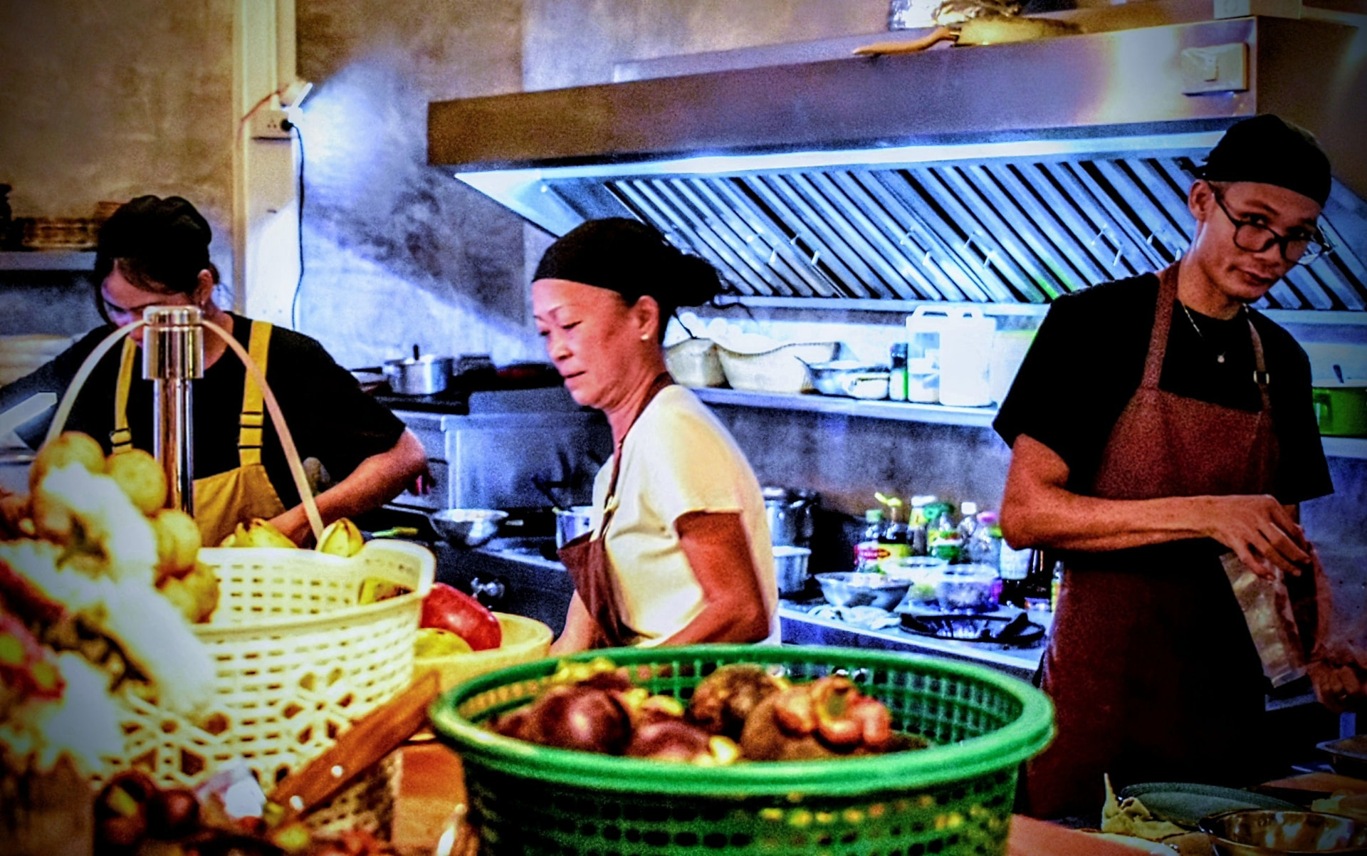 Chef P.oy cooking on the line in the open kitchen