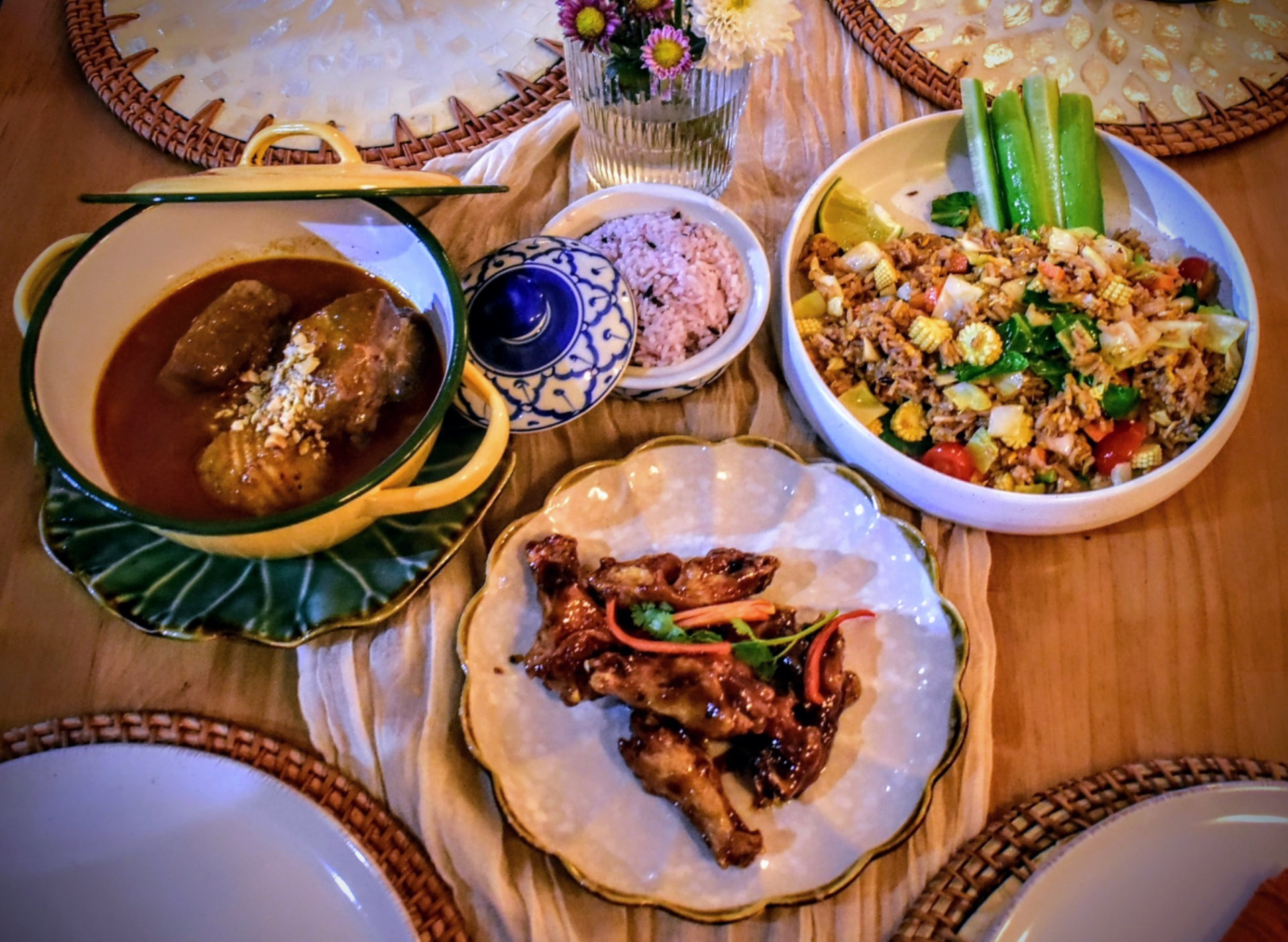 Massaman, pork fried rice and sticky chicken wings shared at the table