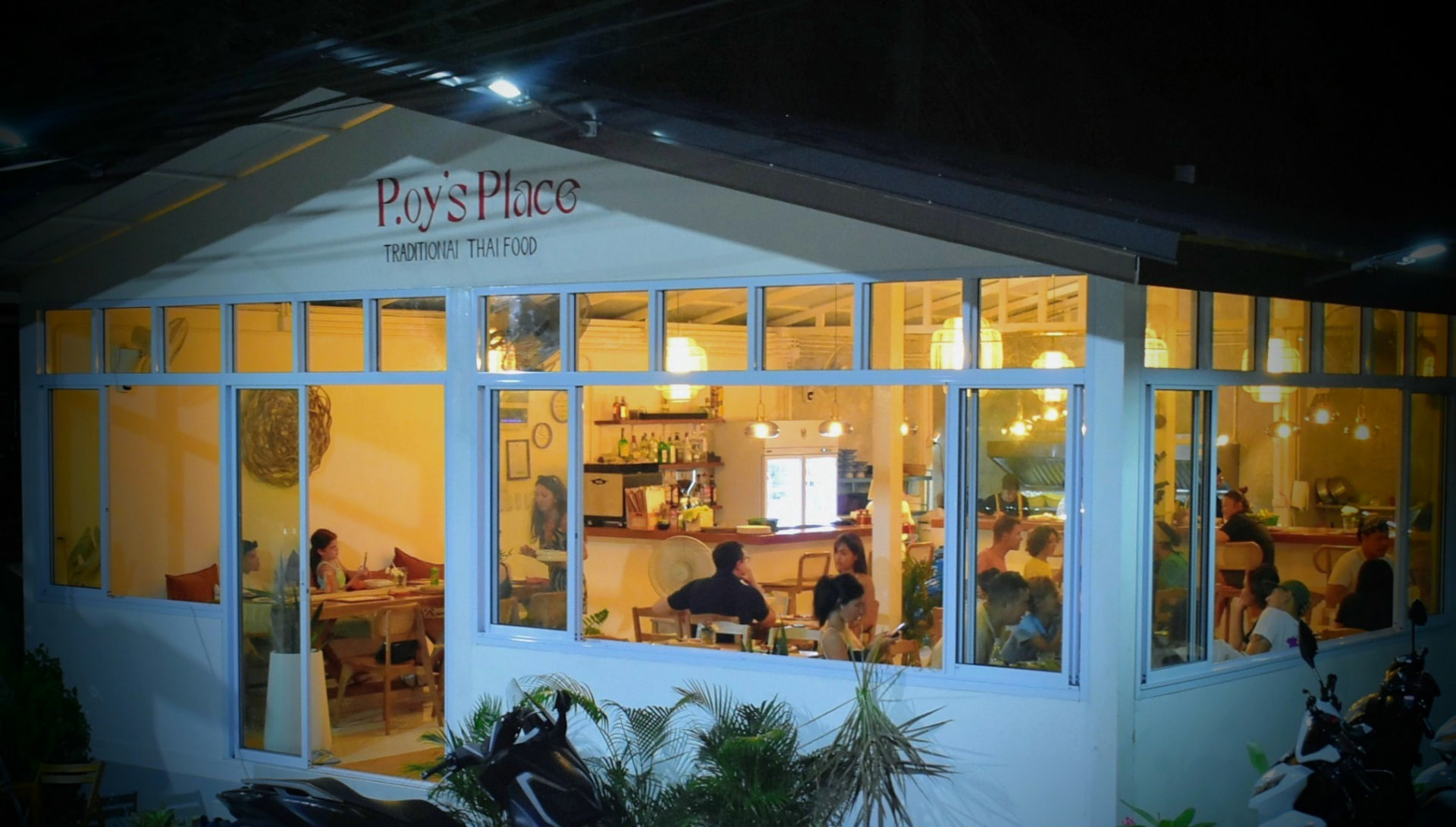 P.oy's Place seen from an angle with a full dining room
